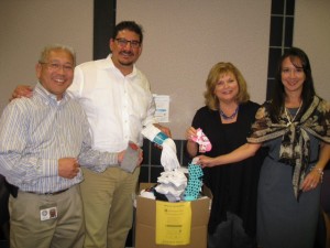 Supervisor Serna and staff collect socks for SOCKtober Drive 